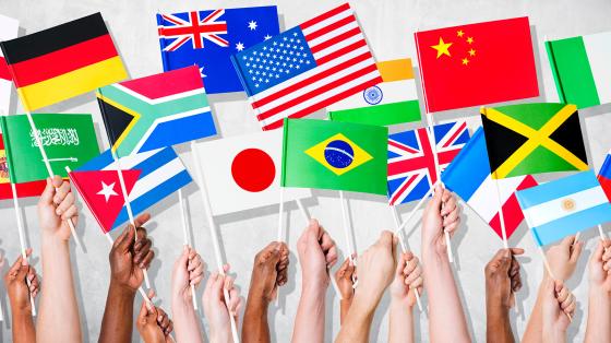 stock photo of hands holding flags from different countries