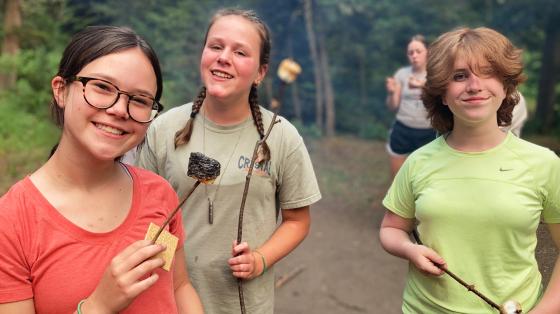 campers holding s'mores