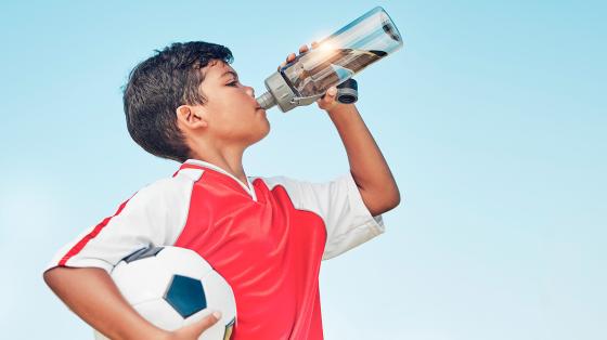 Kid drinking from water bottle