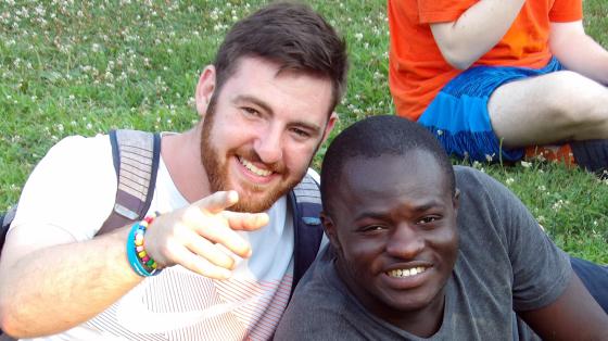 camper and counselor smiling together