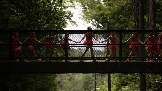 Campers walking over bridge