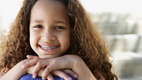 Child smiling with braces