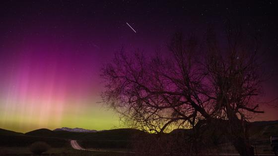 The aurora paints the sky near Malad City, Utah, red, purple, and green