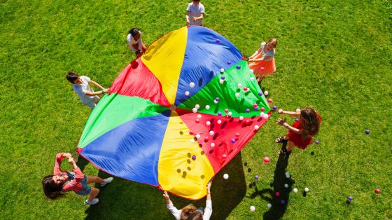 Youth playing with parachute