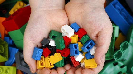 Hand holding legos