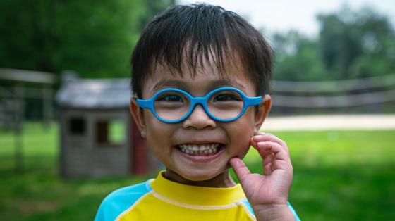 Camper with glasses smiling