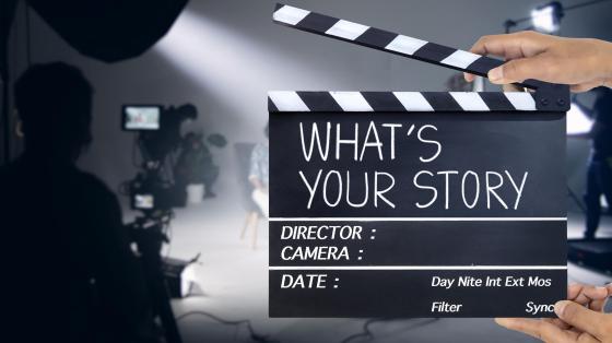Person holding a clapperboard