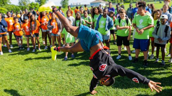 camp staff doing cartwheel