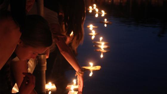 campers releasing wishing boats