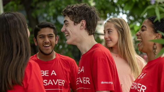 Young adults wearing Be A Lifesaver tshirts