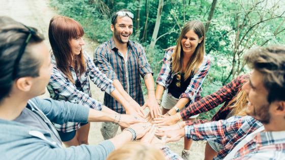 Young adults hands in circle