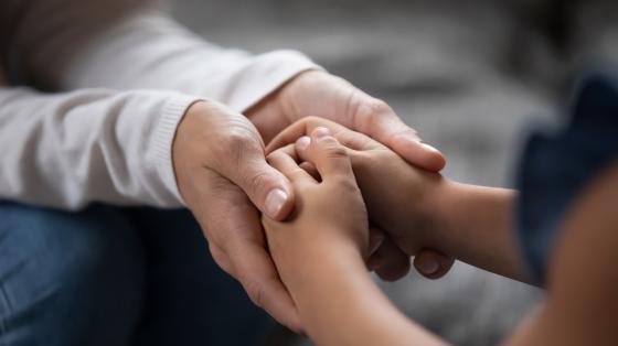 hands of child and parent
