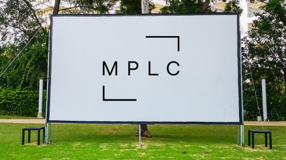 Outdoor movie screen with licensing logo
