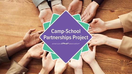 Camp School Partnership logo being held by hands