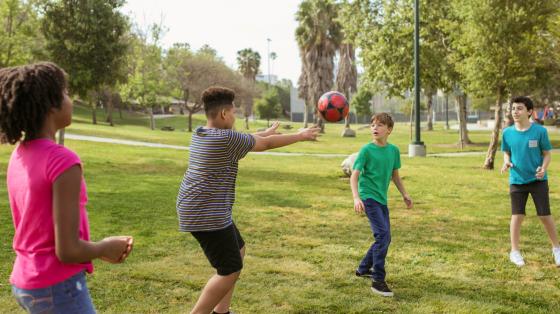 Kids playing with ball outdoors