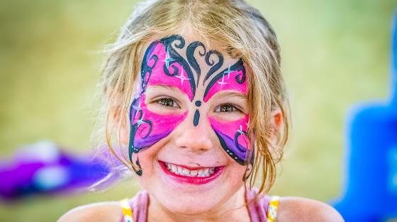 camper with butterfly face paint