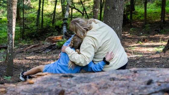camper and staff hugging