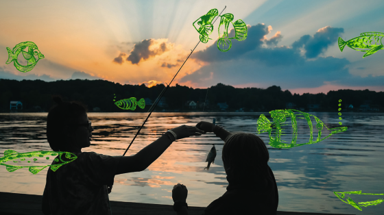 Two campers fishing at sunset