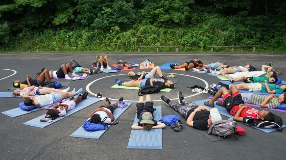 group of campers lying in circle