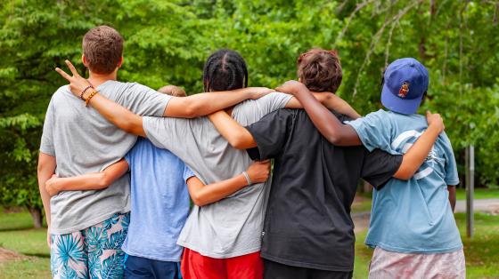group standing together facing away from camera