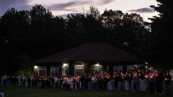 Group at night with candles