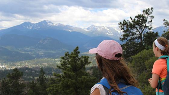 campers looking over mountains
