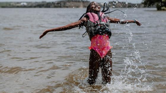 camper wearing life jacket in lake