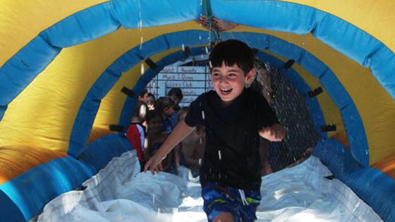 camper running through water tunnel