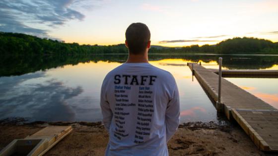staff member looking out over lake