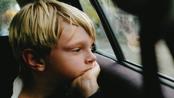 boy looking out car window