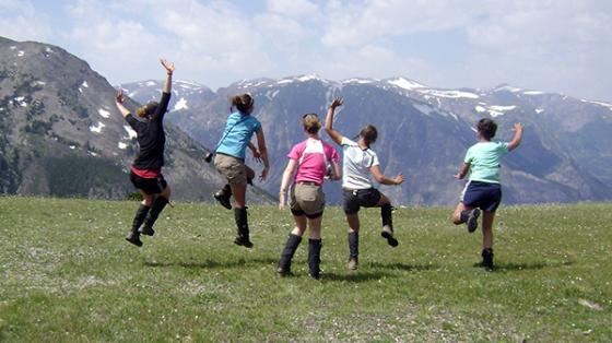 campers with mountains in background