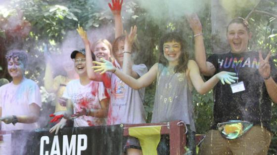 Campers throwing powder up in the air