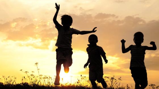 silhouettes of kids at sunset