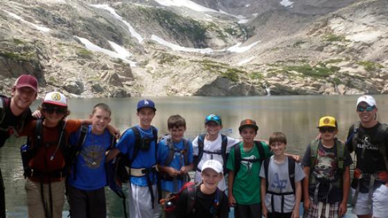 group of kids next to lake