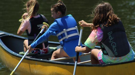 campers in a canoe