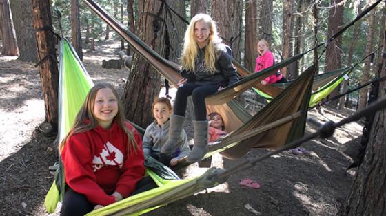 Campers sitting on hammocks