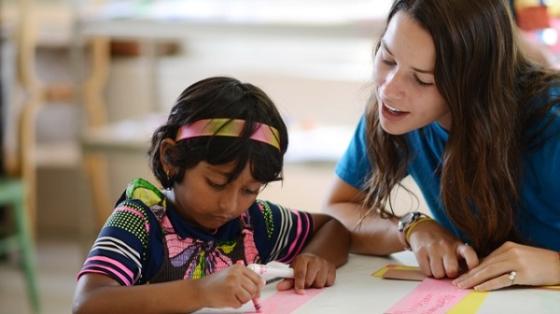 teacher helping student