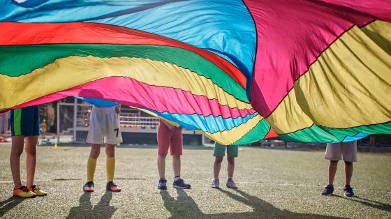 kids playing with parachute