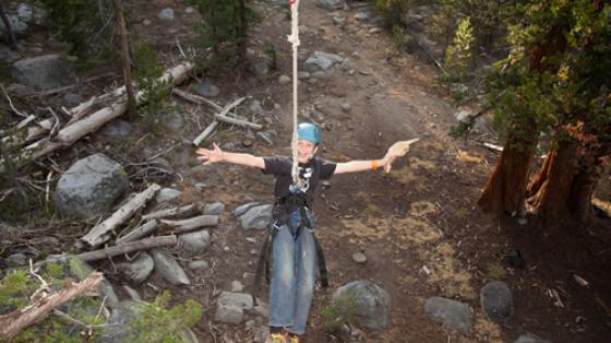 Camper on a zipline at Golden Arrow Camp in Clovis, CA