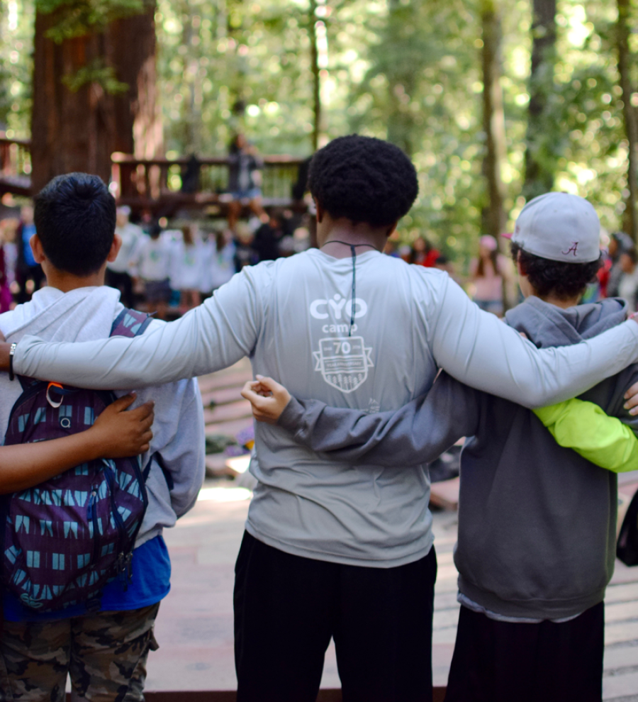 Group of staff and campers in a circle