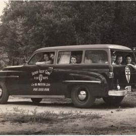 Historical photo of campers in car