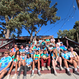 Camp staff group sitting on stairs