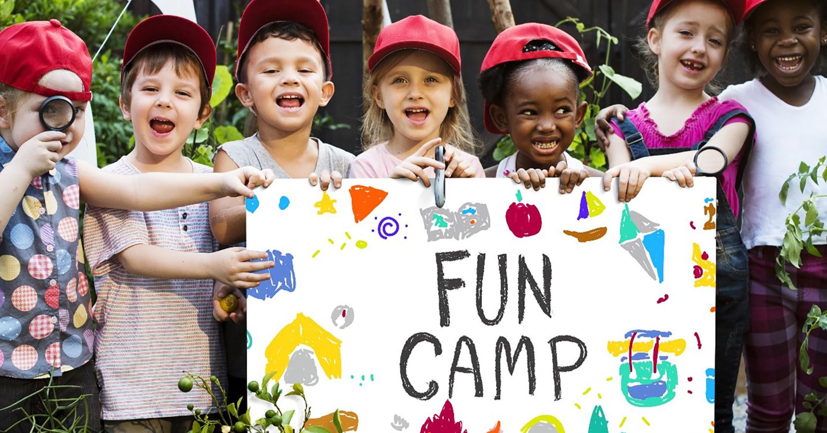 campers with fun camp sign