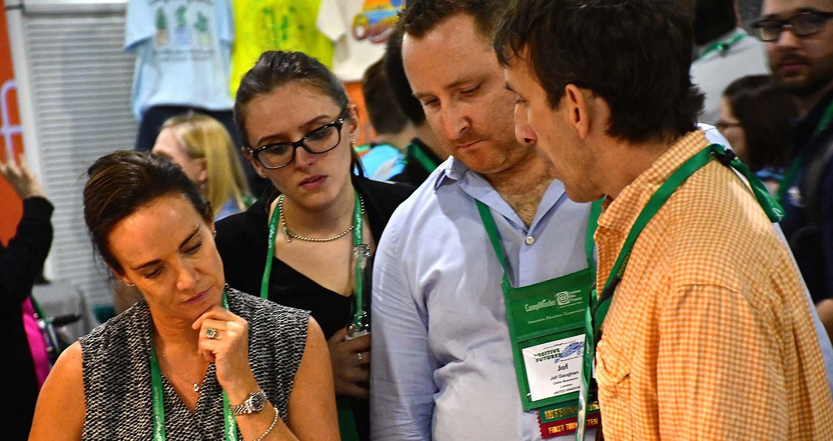 A vendor talking with attendees