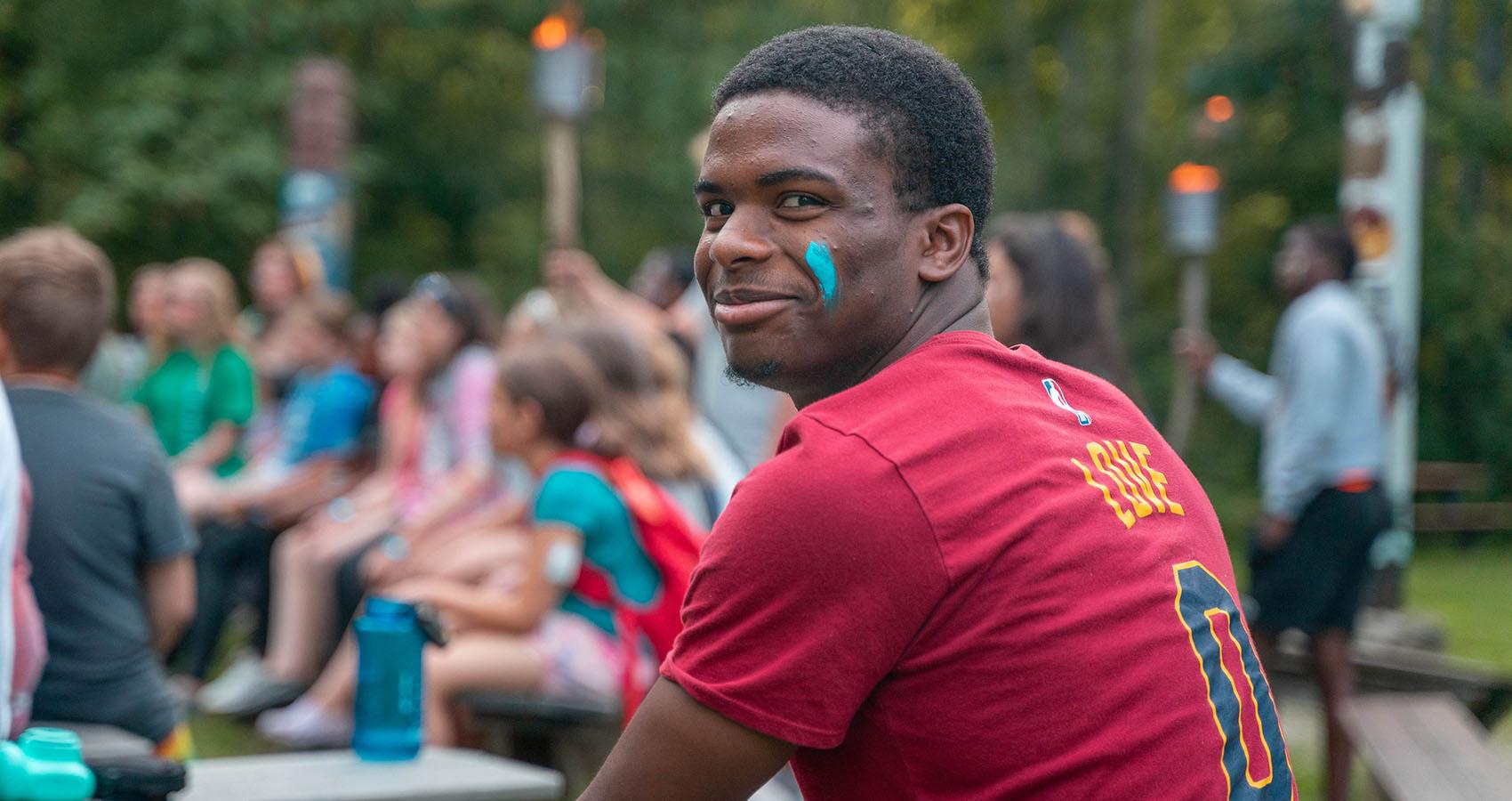 camp staff member with face paint