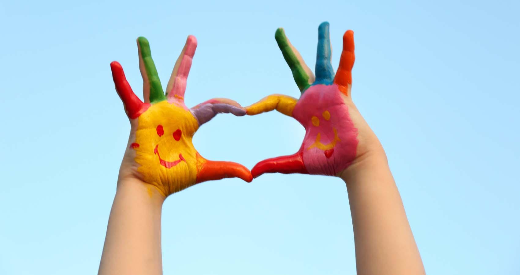 painted hands making heart shape