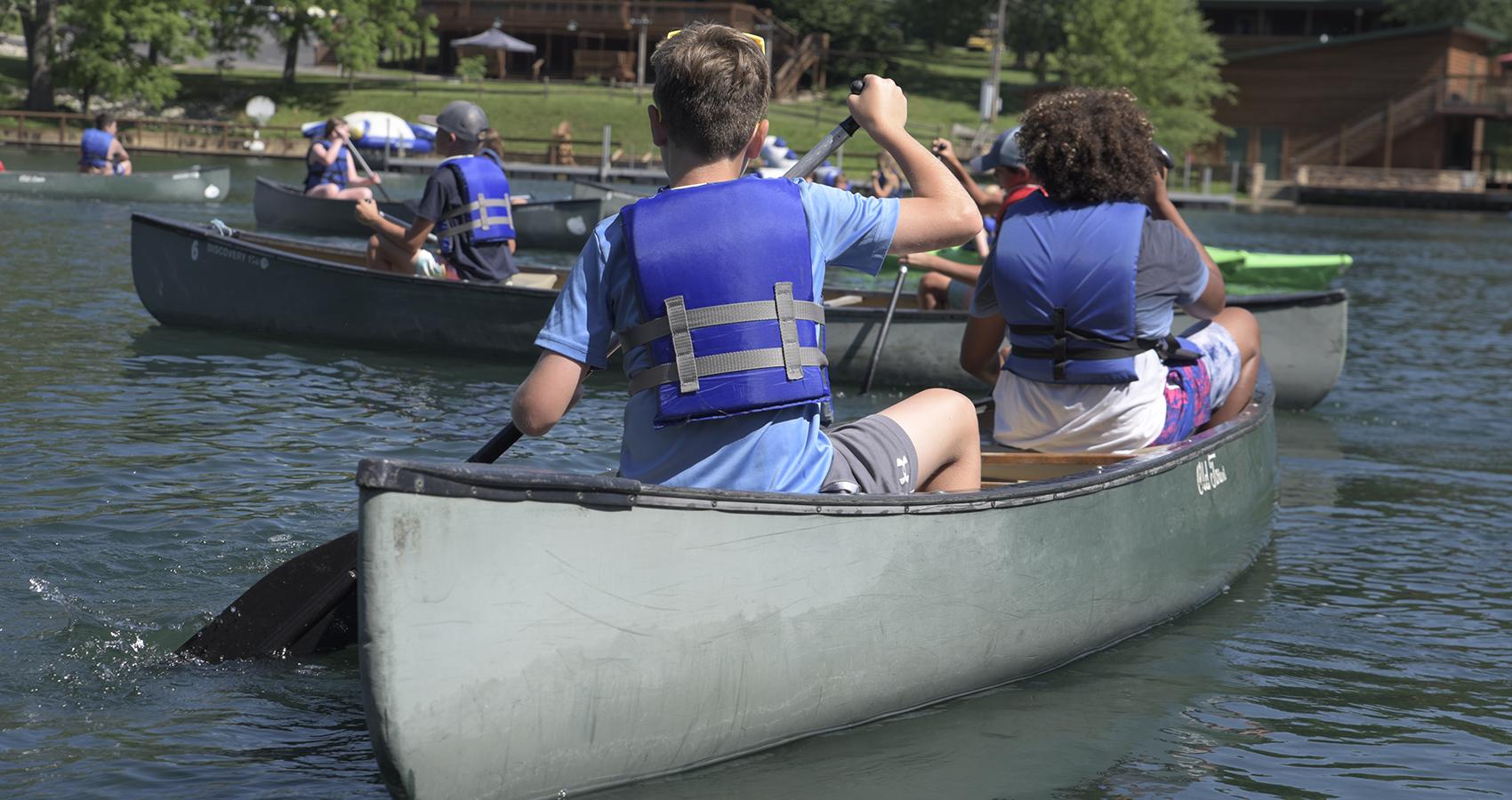 campers canoeing