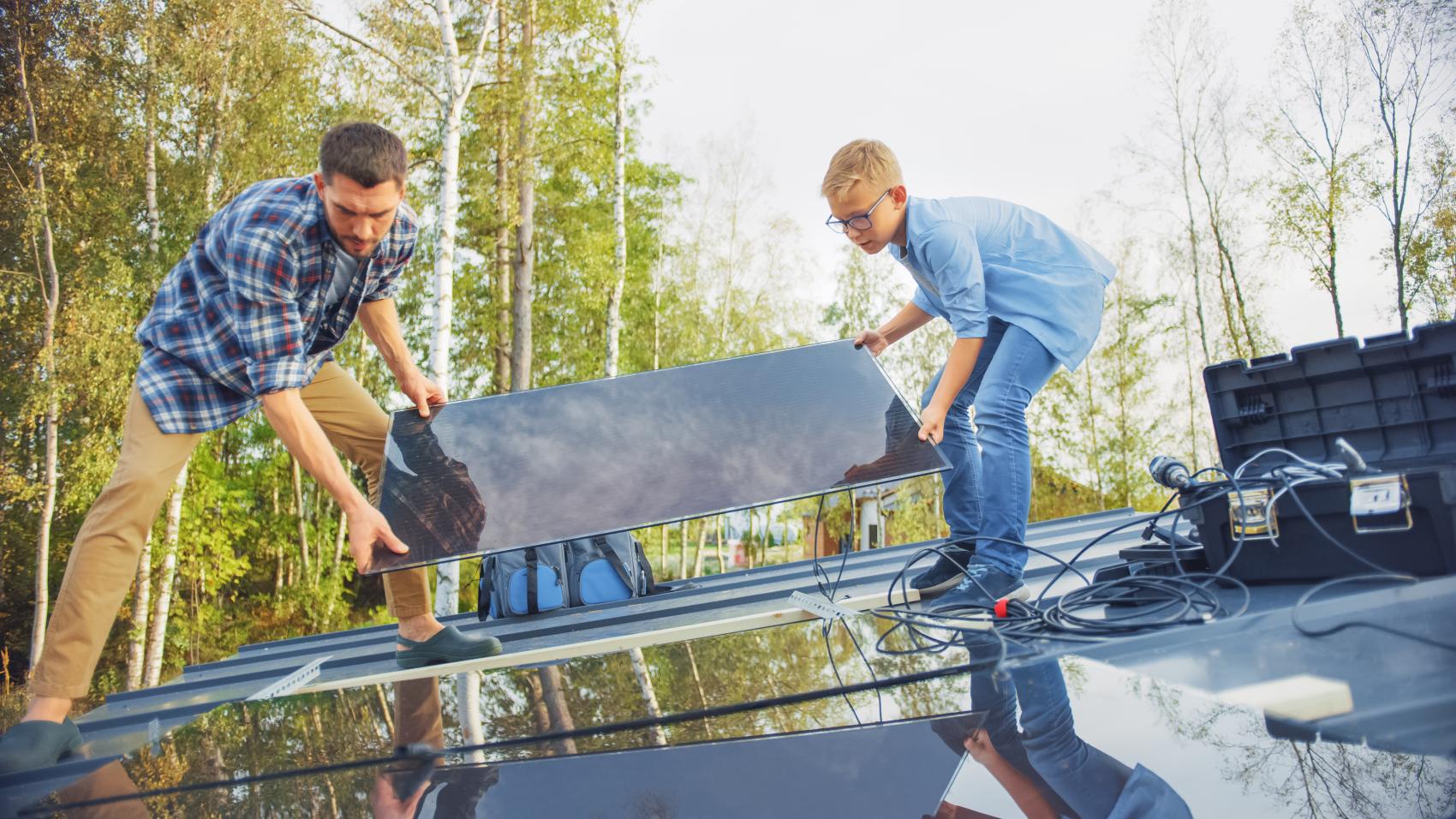 adult and child unloading truck