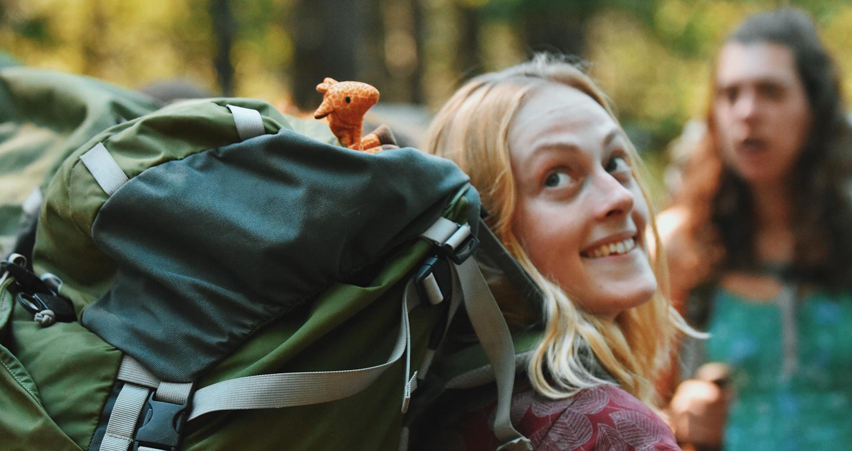 staff with backpack