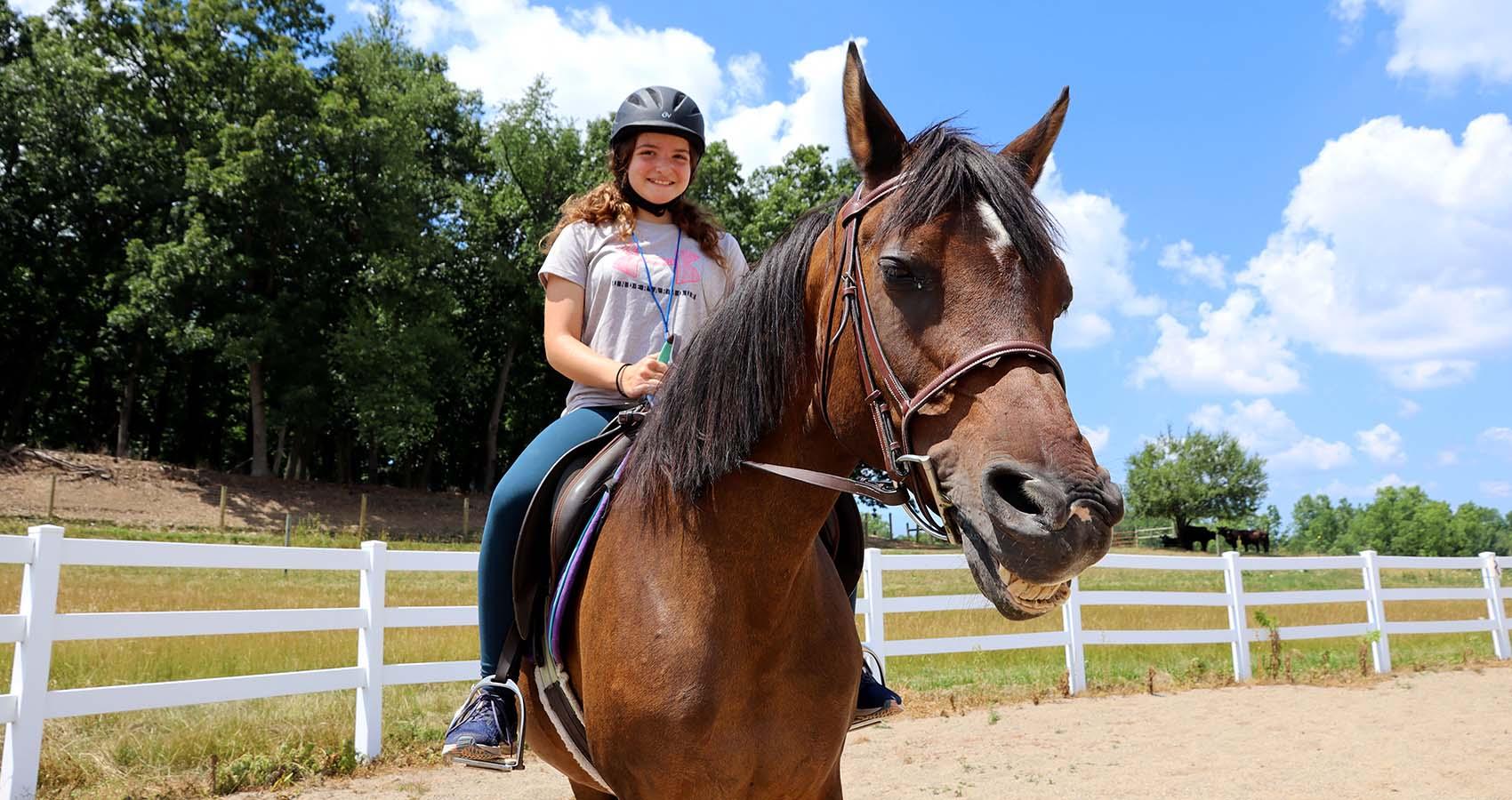 camper riding horse